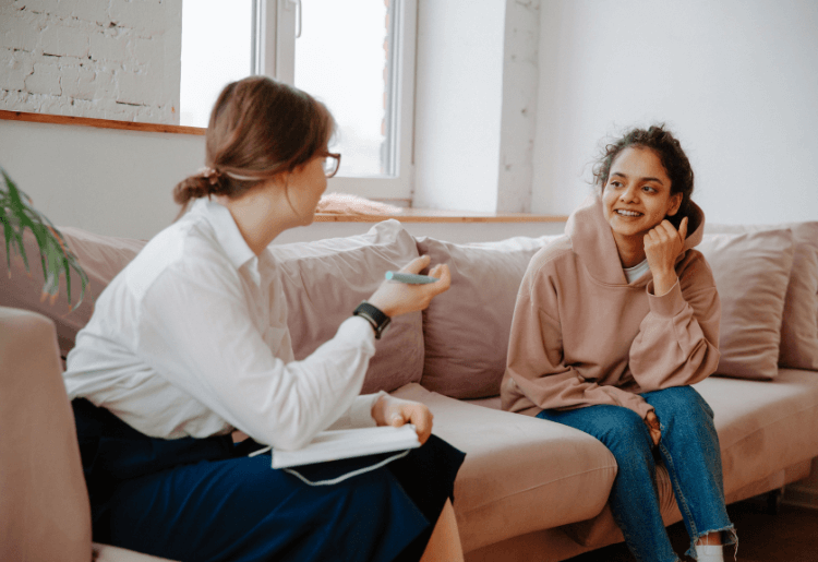 social worker talking to teenager